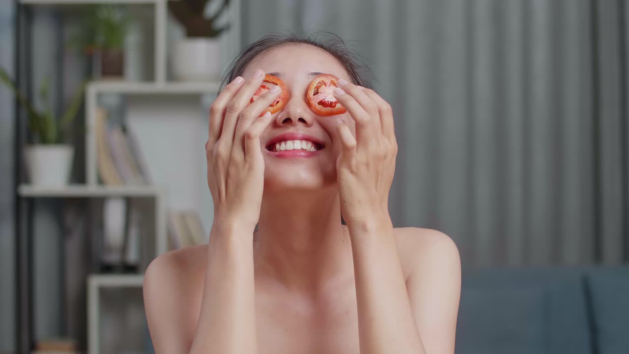 Woman Applying Tomato Slices as an Eye Mask