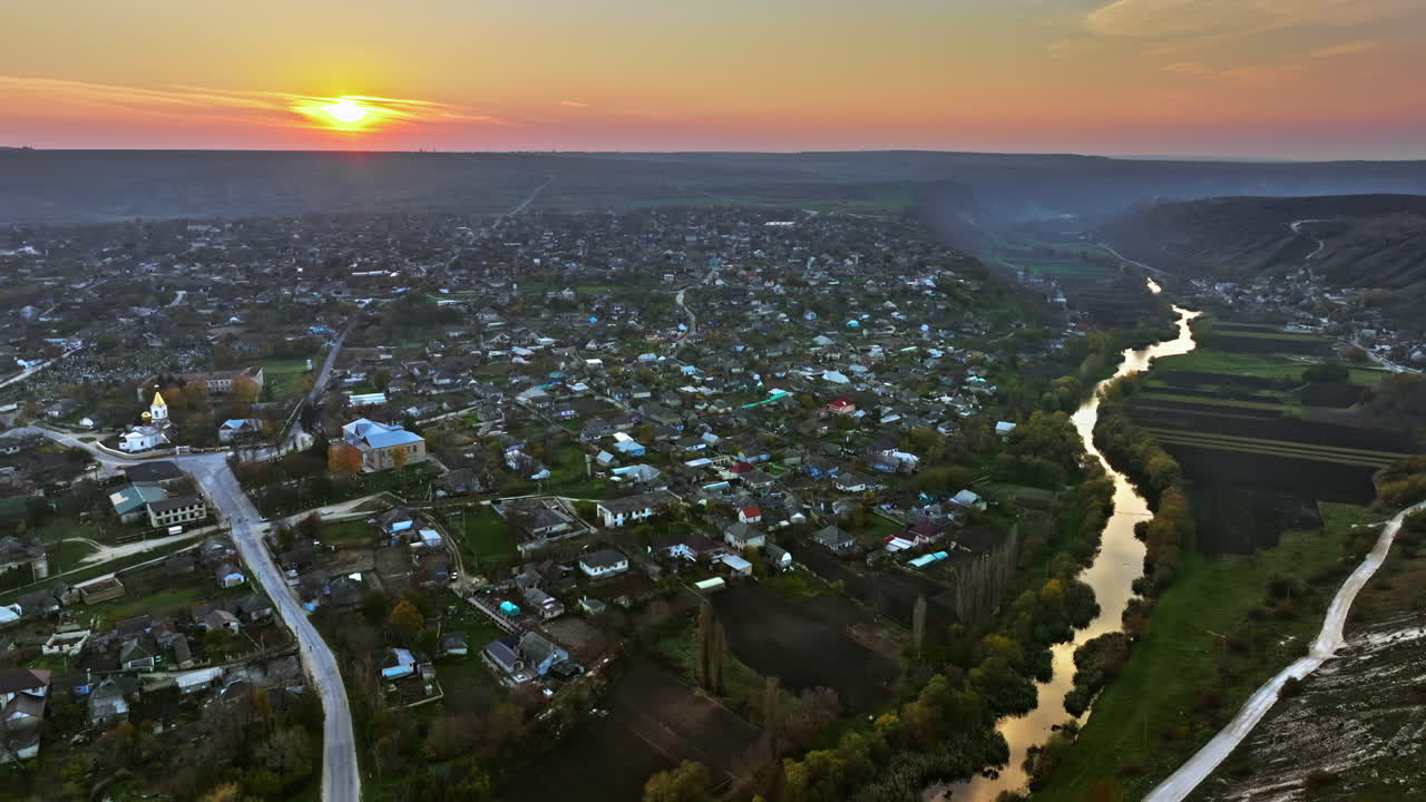 Aerial drone view of Orhei, Moldova and the Raut river at sunset