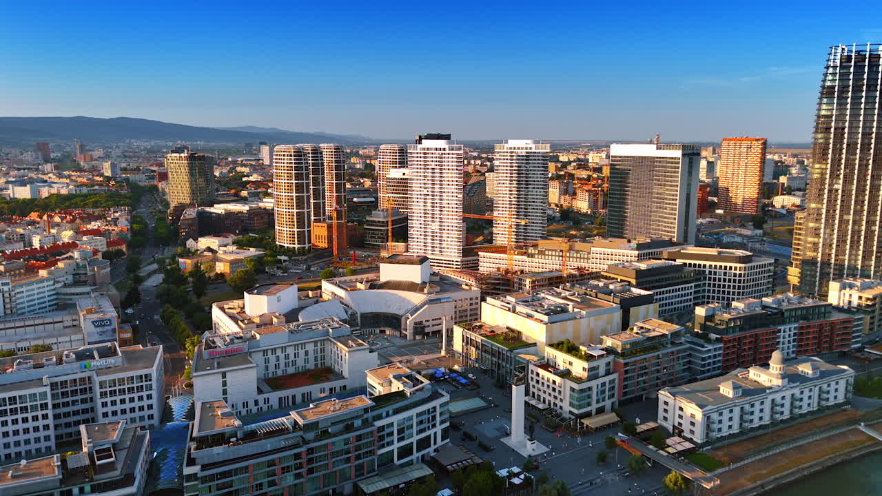 Bratislava, Slovakia, 2 June 2025: Bratislava skyline and city life. The view captures Bratislava's skyline, showcasing modern buildings and urban development under a clear blue sky