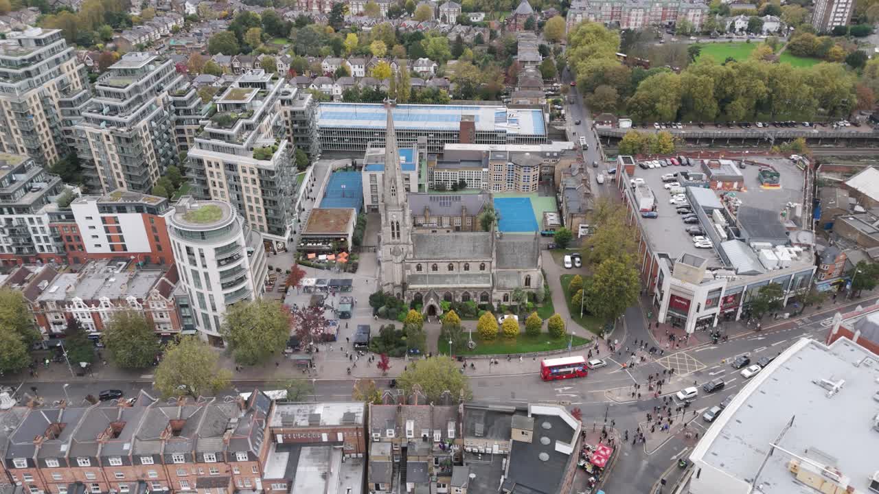 Drone orbital of Central Ealing featuring historic Church of Christ the Saviour and surroundings in London, UK, October 2024