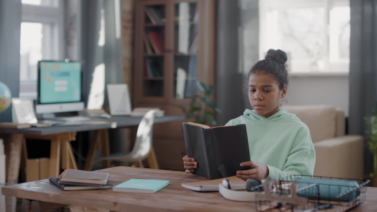 Afro Girl Reading At Home