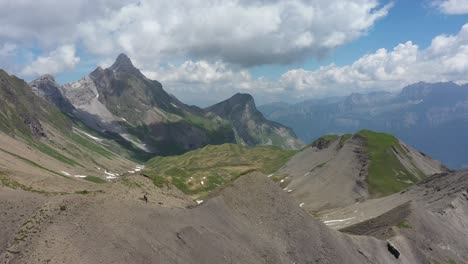 Aerial-view-of-a-hiker-in-a-mountainous-landscape