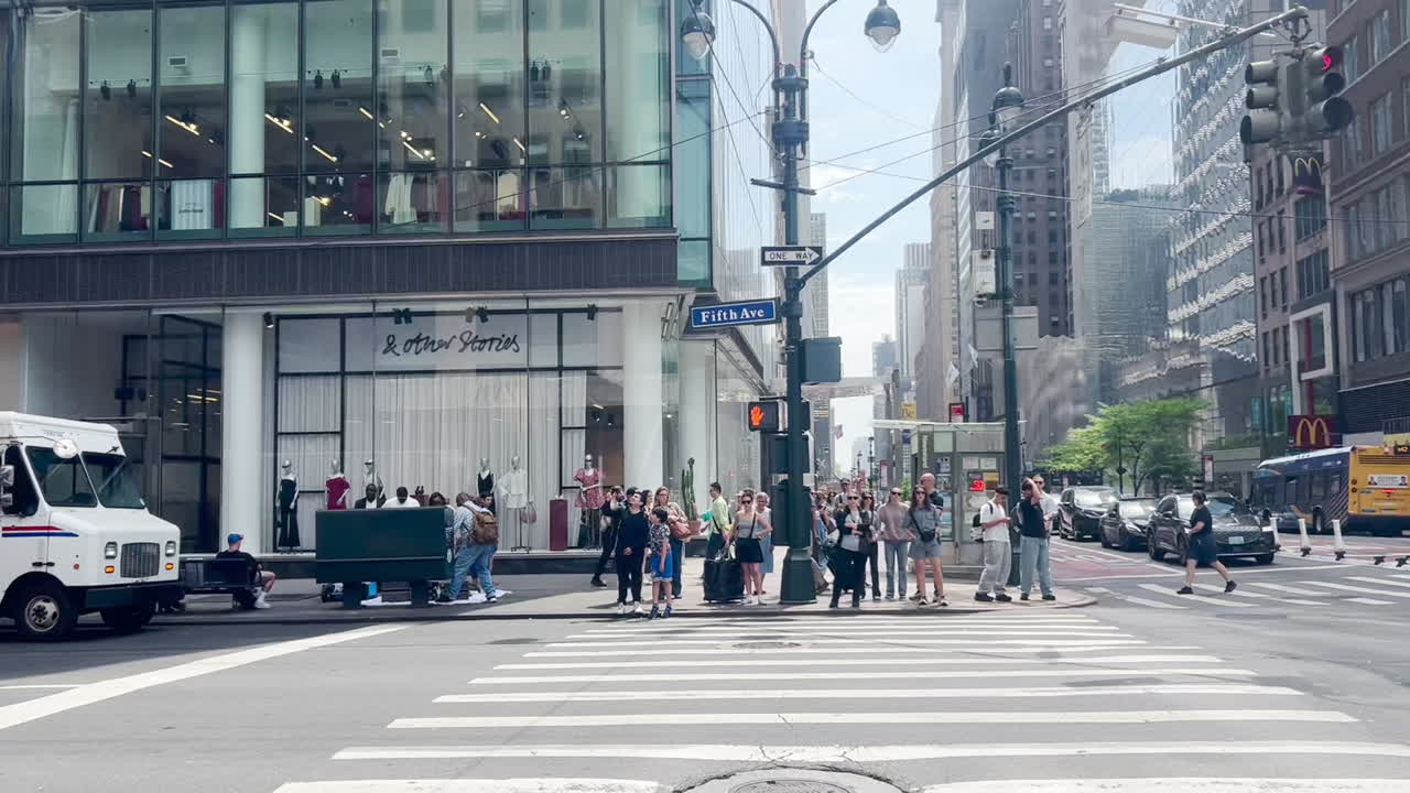 Busy Fifth Avenue street corner in Manhattan