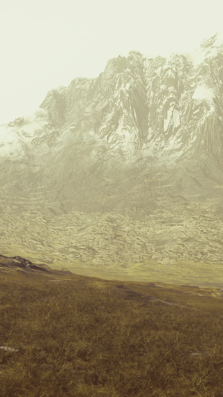 Majestic mountain landscape under a soft haze during dusk