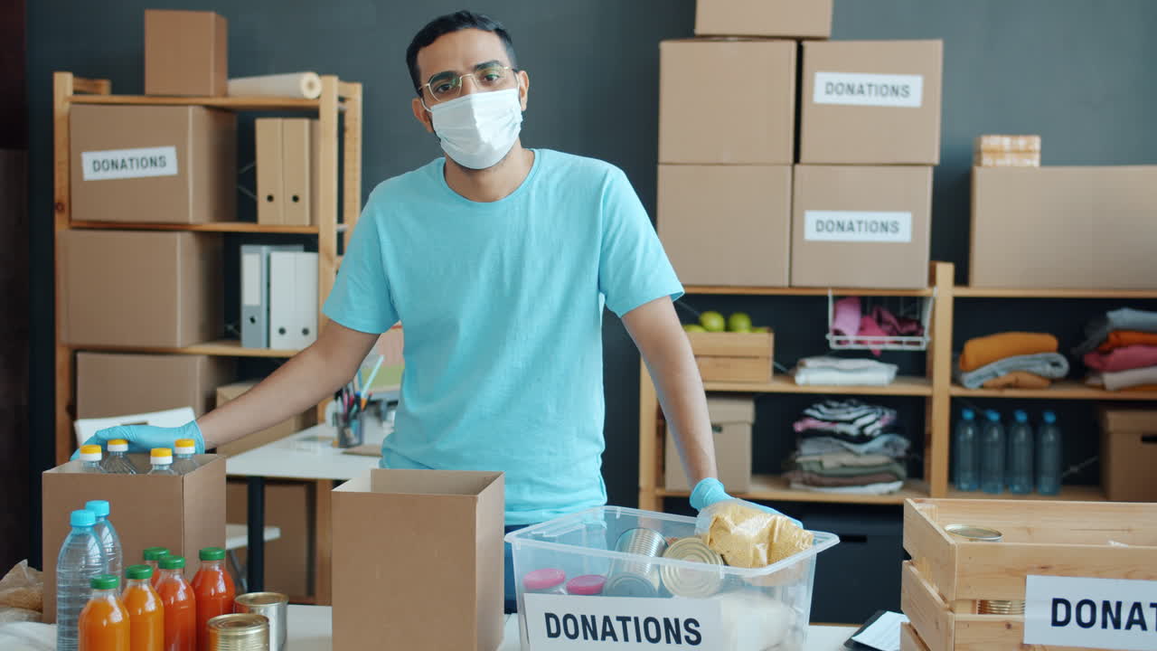 Volunteer sorting donations at a charity center
