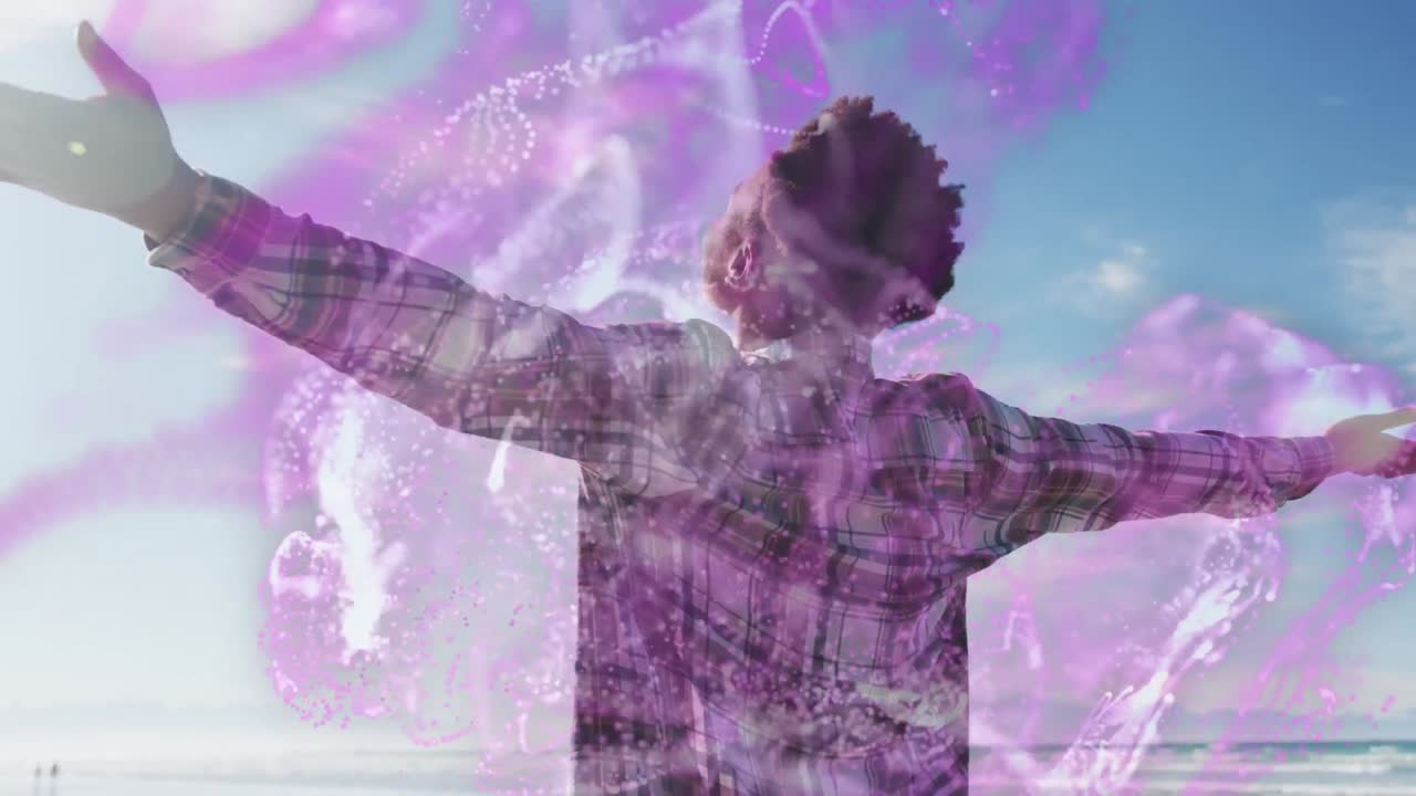 animación de olas sobre feliz mujer afroamericana con las manos levantadas