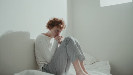 young man feeling distressed and anxious in psychiatric ward
