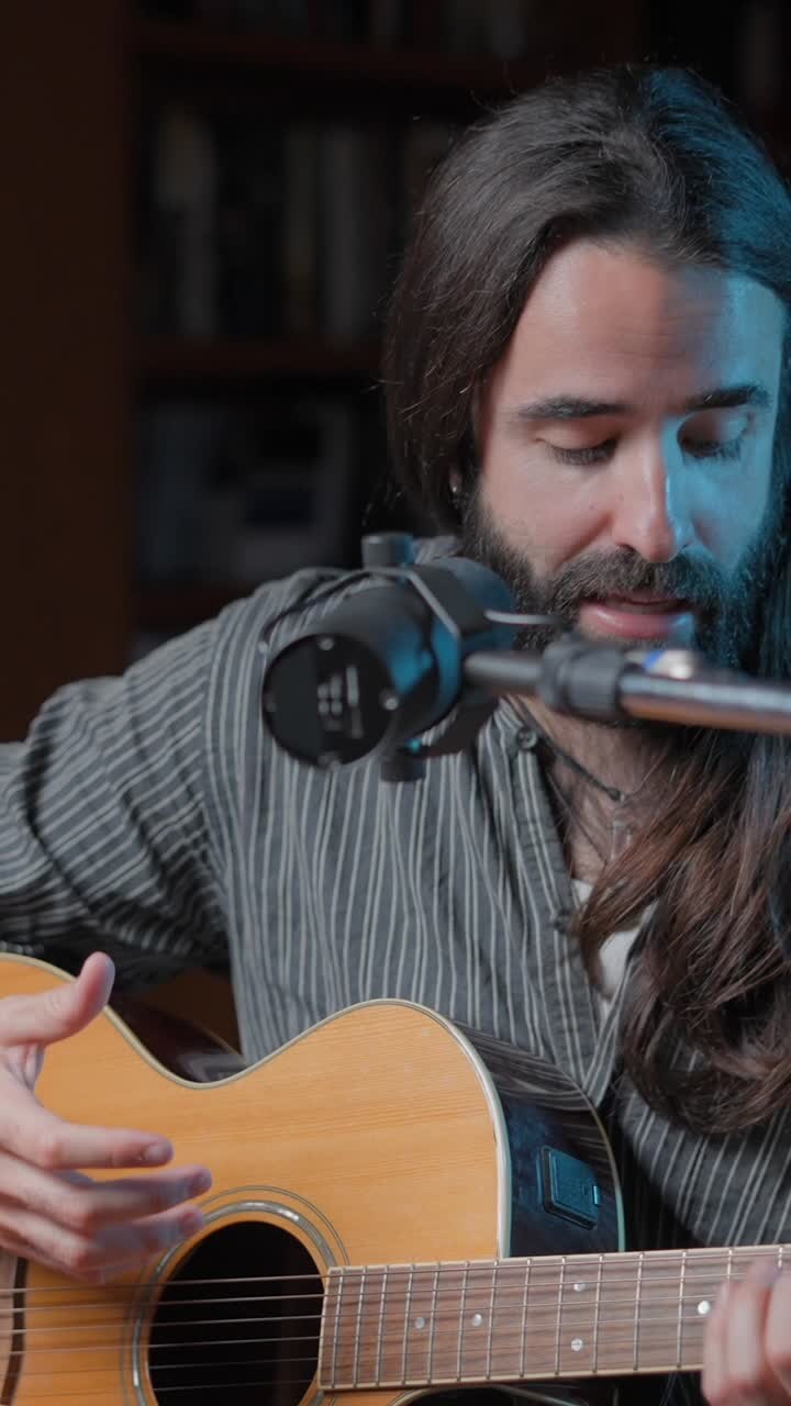 Musician Performing with Acoustic Guitar and Microphone