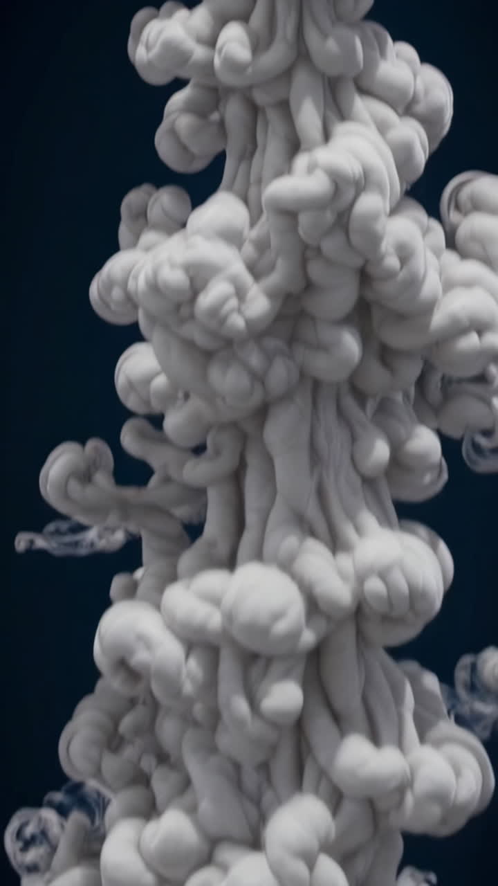 White Smoke Plume on Dark Background