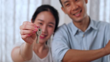 couple holding their new house keys