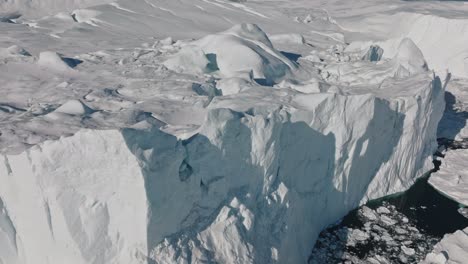 drone over sea and ice of ilulissat icefjord