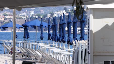 blue umbrellas by the sea in sorrento