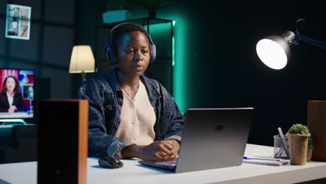 young woman studying late night at home