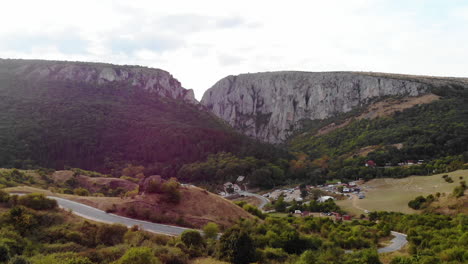 Flying-toward-Turda-Gorge,-early-autumn-colors