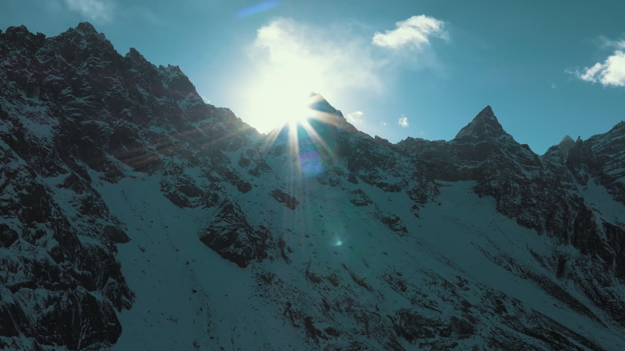 Majestic Mountain Peaks Under a Golden Sunrise