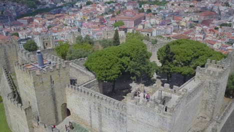 aerial drone footage of the lisbon medieval castle in the medieval old town in portugal capital city