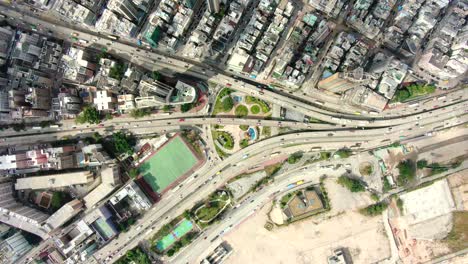 hong kong downtown kowloon urban area, top down aerial view with traffic and city skyscrapers