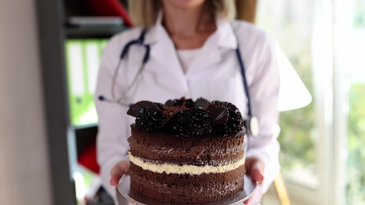 Doctor Holding a Chocolate Cake