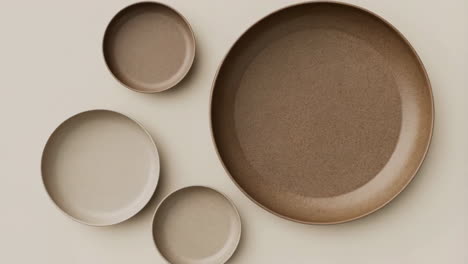 collection of neutral-toned plates and bowls