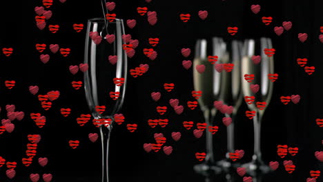 champagne glasses with red hearts and lips animation over black background