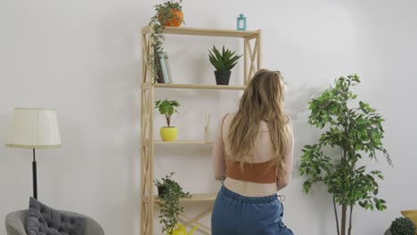 young woman dancing in living room