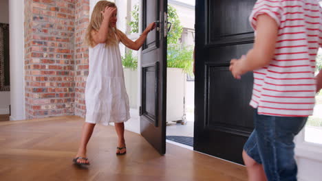 grandchildren run to greet grandparents as they arrive
