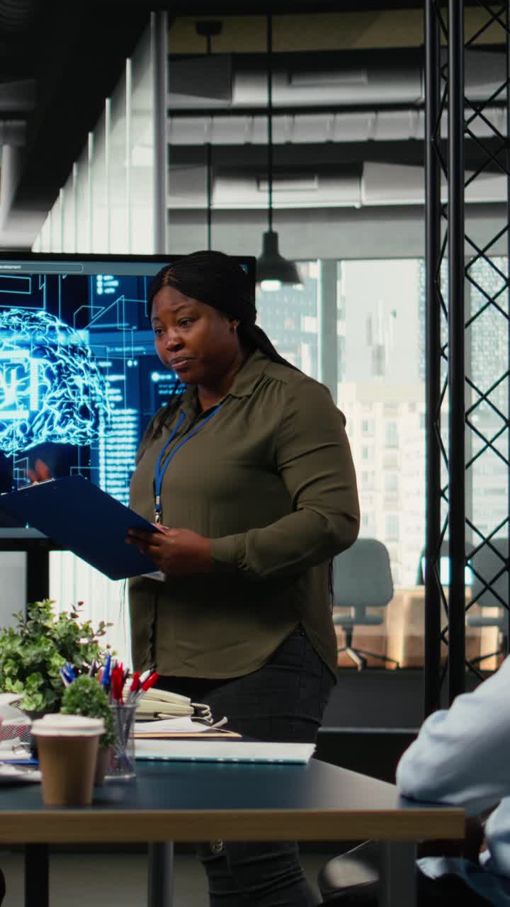 Vertical video Investors meet in startup office to hear technology presentation