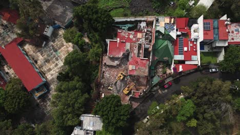 drone close-up of a house under demolition