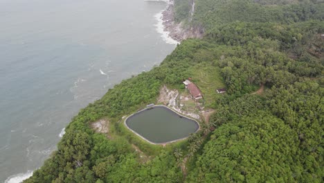 aerial view of grigak reservoir which is a reservoir in gunungkidul, yogyakarta, indonesia which is close to the sea with cliffs.