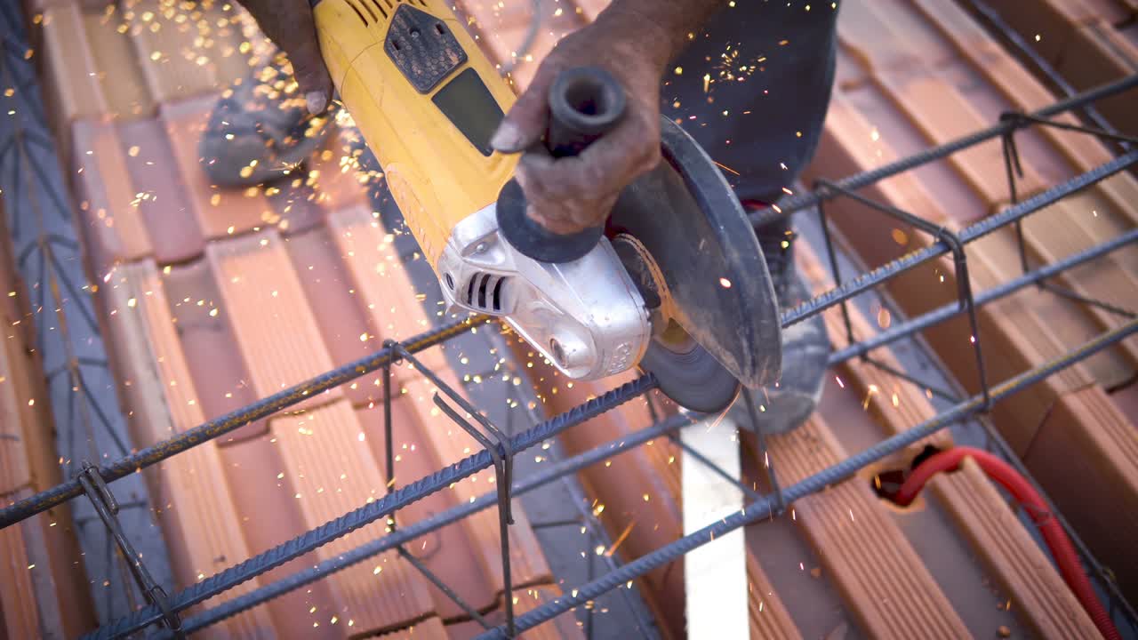 Angle Grinder Cutting Metal Armature, Building construction site