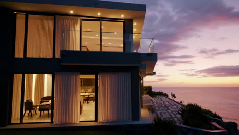 modern luxury villa with ocean view at sunset