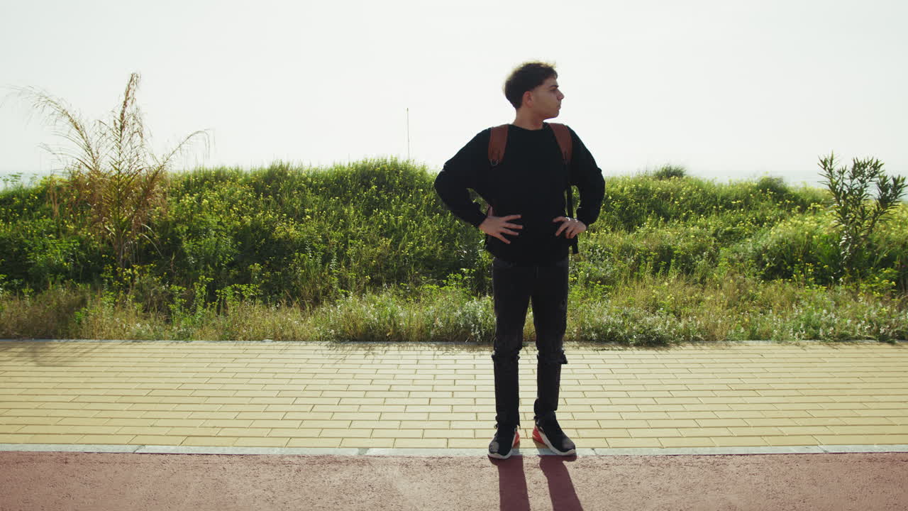 Eternal Waiting For A Bus Of A Man On The Sidewalk Near The Sea