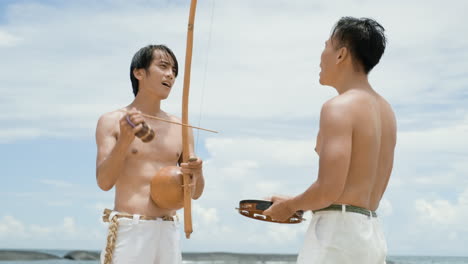 men singing and playing musical instruments