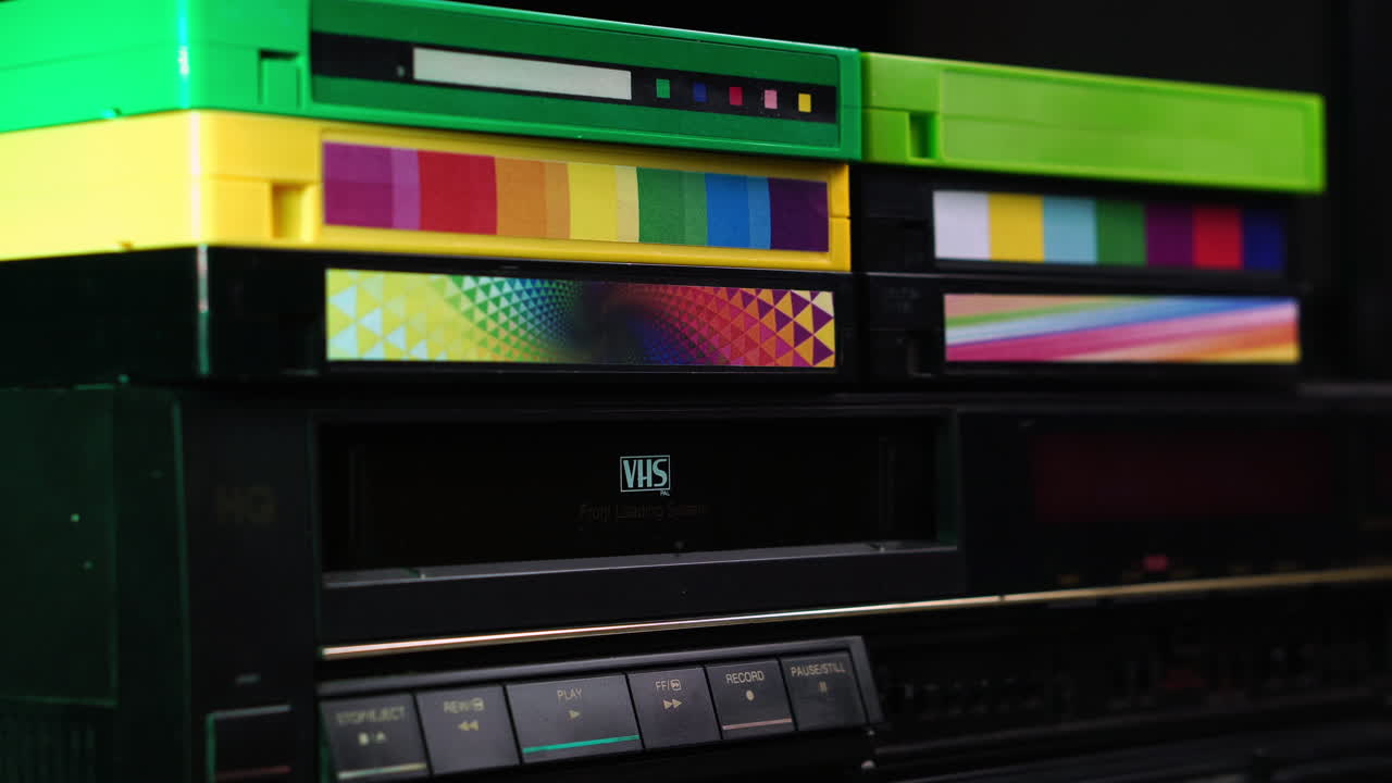 Family Vacation VHS Video Cassette Tape Ejecting From VCR, Close Up