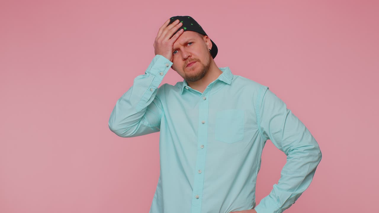 Man rubbing temples to cure headache problem suffering from tension and migaine stress pain