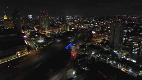 a nighttime aerial establishing shot of the city of san antonio, texas