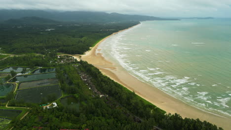 Khao-Lak-village-beach-shoreline,-Agricultural-land-close-to-beach,-Thailand