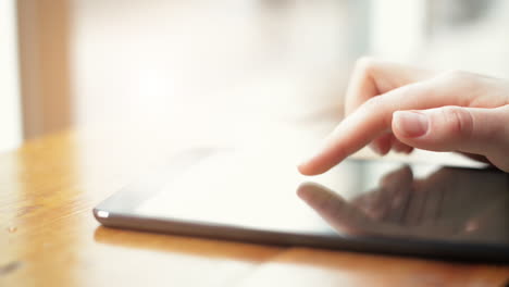 woman using tablet computer close-up