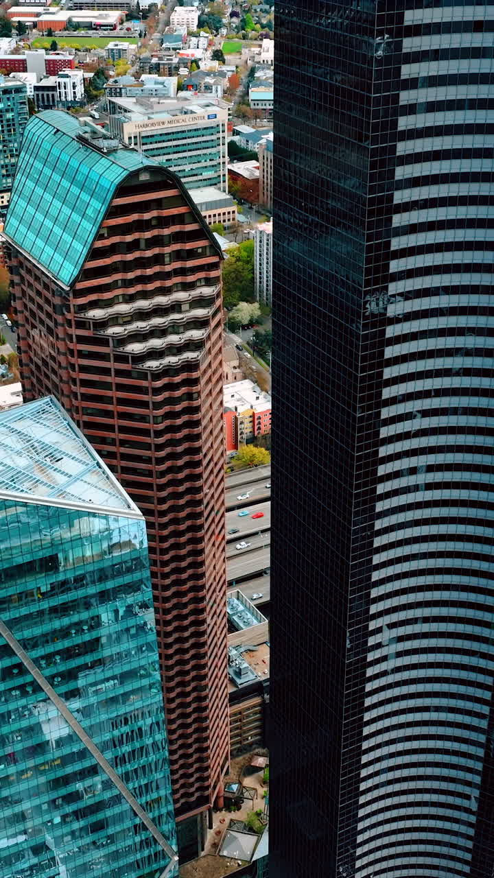 Business skyscrapers Seattle city aerial view. American buildings landmark. Vertical video
