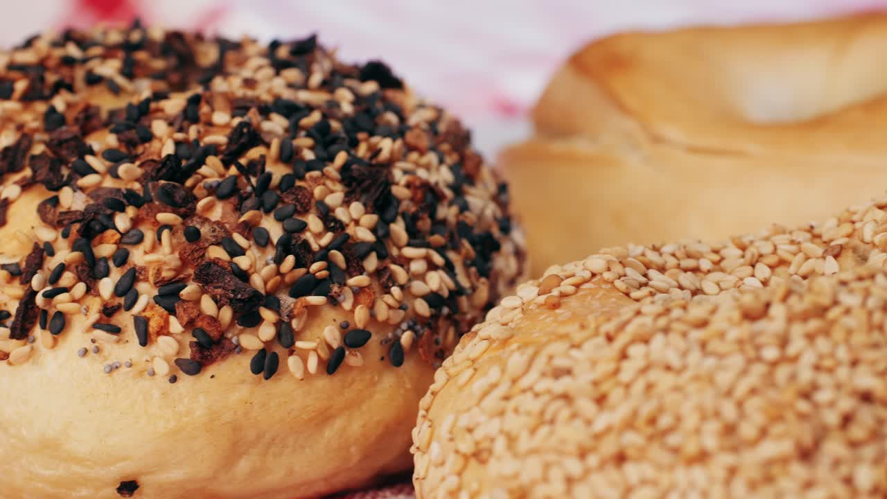 Bagel sandwich brunch, lunch plate of a bagel with smoked salmon and cream cheese and ham, close up morning cafe menu.