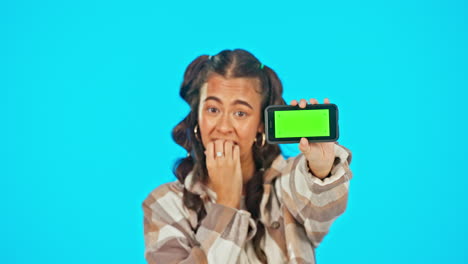 Phone,-green-screen-and-nervous-woman-in-studio