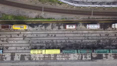 aerial pan view of a railway with differents types of wagons