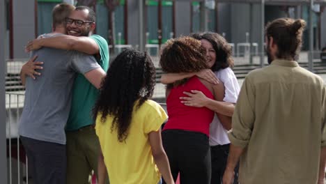 multiethnic friends greeting each other outdoor