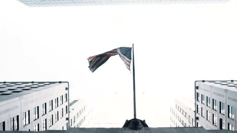 elevated view of the skyscrapers and national american flag in new york. office building and skyline in city center