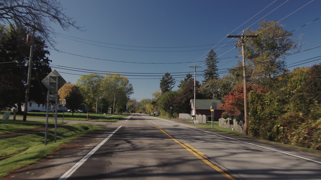 Driving in a typical American suburb, view from the driver's side