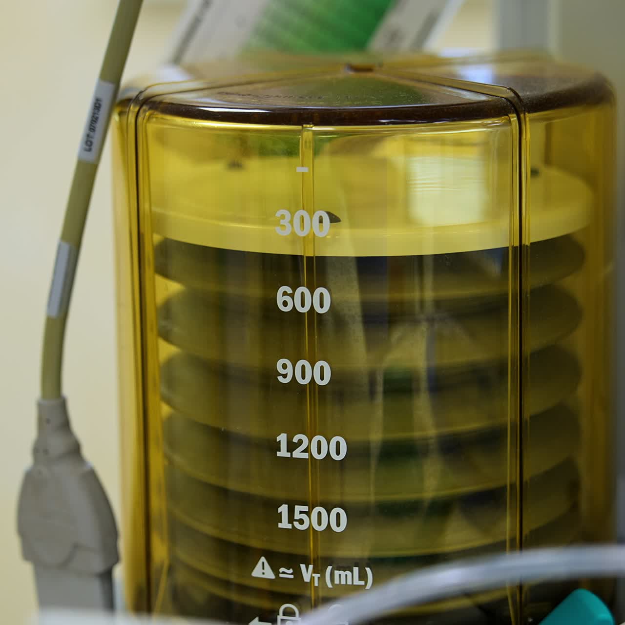 Machine pumping air to patient's lungs. Pulmoflator moving slowly during the surgical procedure. Close up