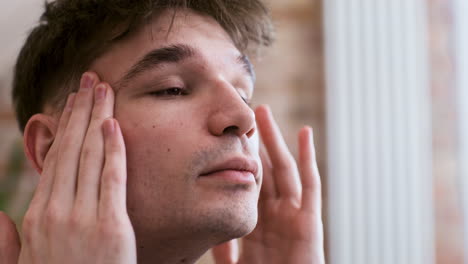 caucasian man touching her face