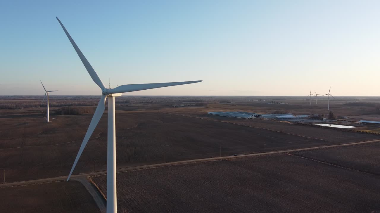 Huge Tall Wind Turbines Spinning In The Middle Of A Vast Farmland Near Ubly, Michigan, USA - Static shot