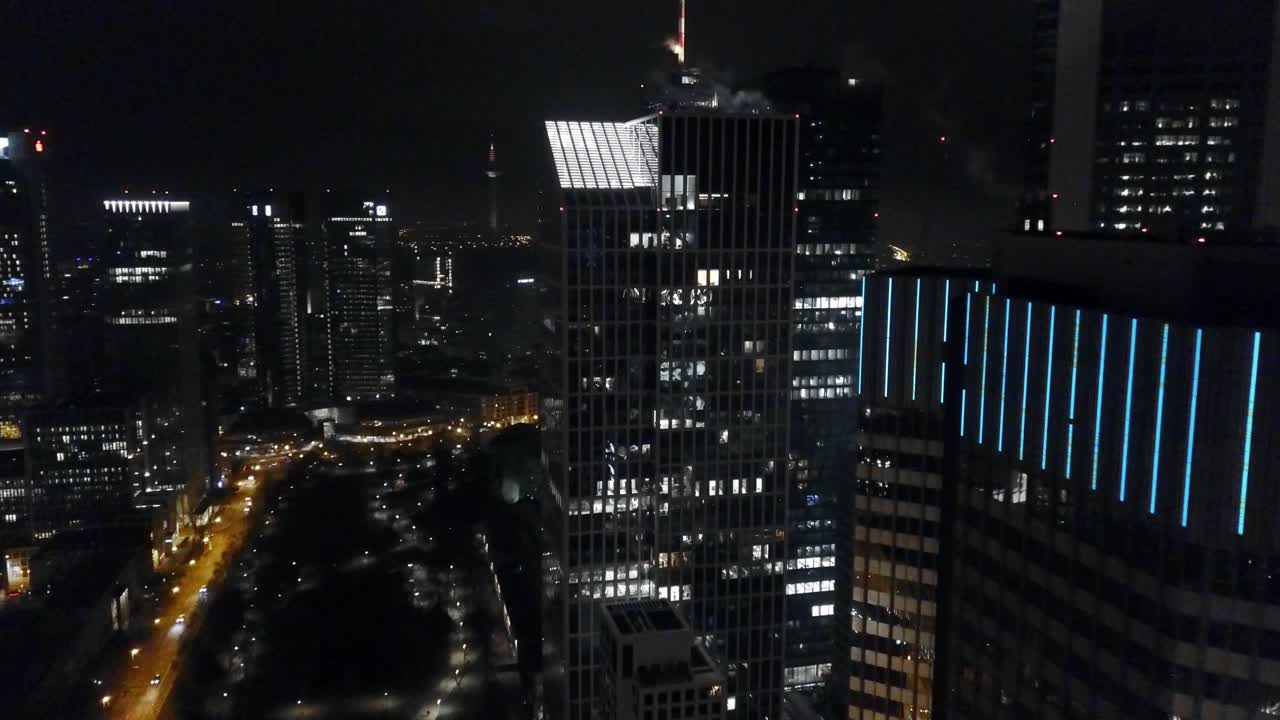flying around through the skyscrapers of frankfurt am main at night