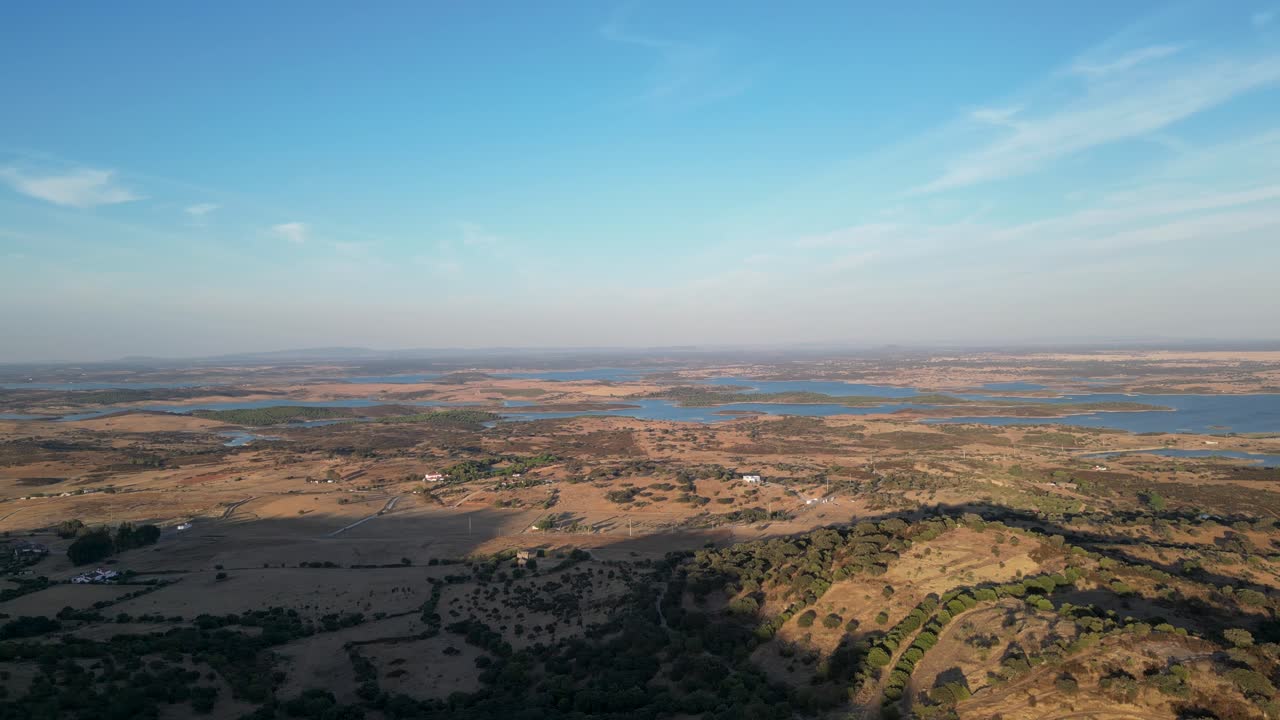 Aerial view of Portugal’s gently curving hills meeting the sea, showcasing a peaceful and scenic landscape where nature's beauty unfolds in harmony.